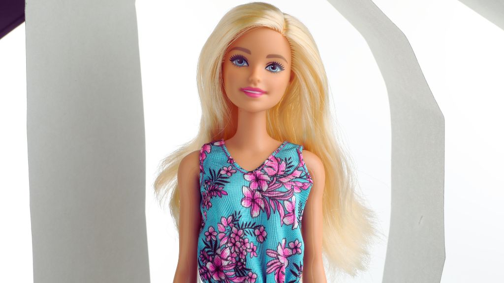 Barbie doll pictured to represent Autistic Barbie, wearing a blue floral dress symbolizing inclusive play and neurodiversity.