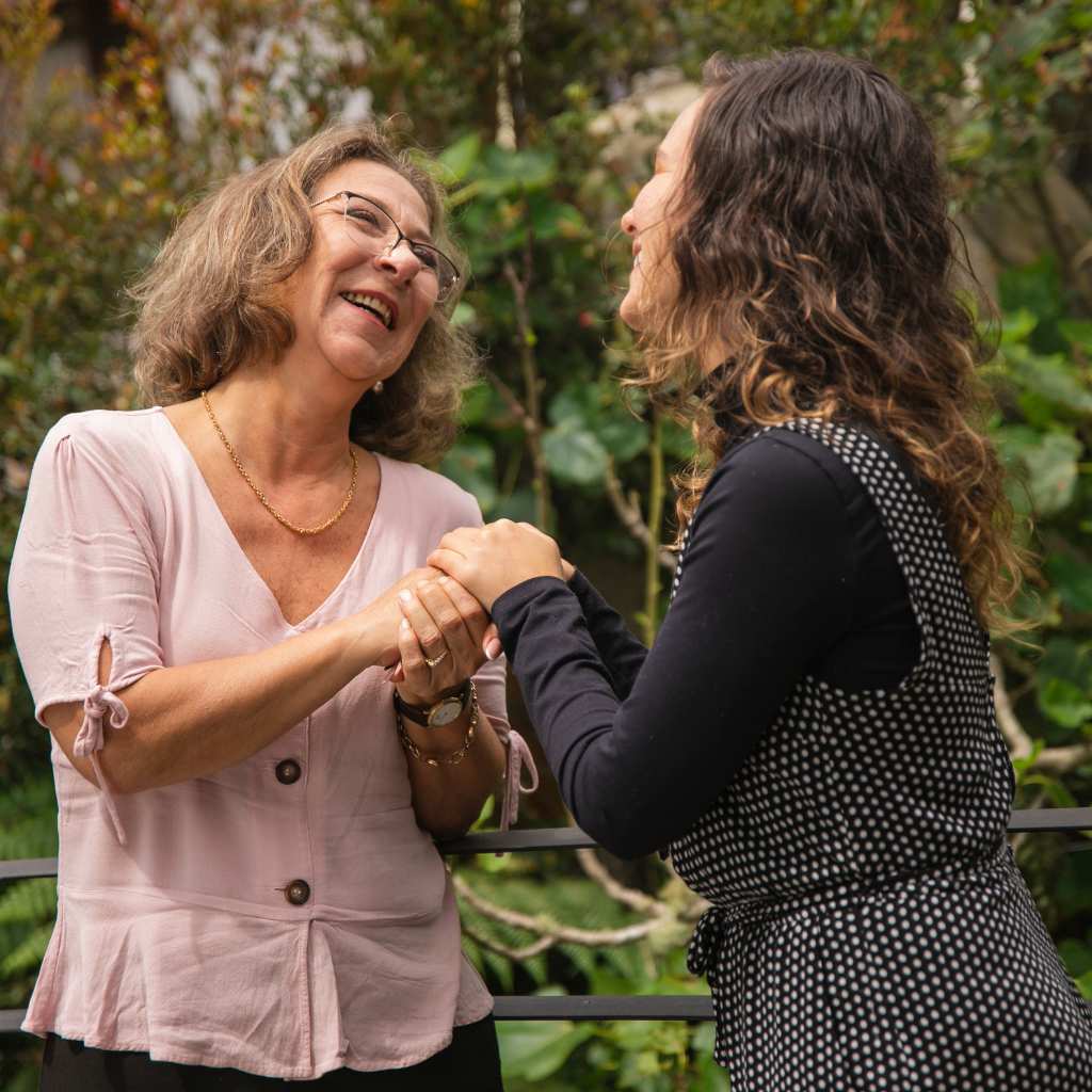 Aging caregiver taking care of her autistic daughter