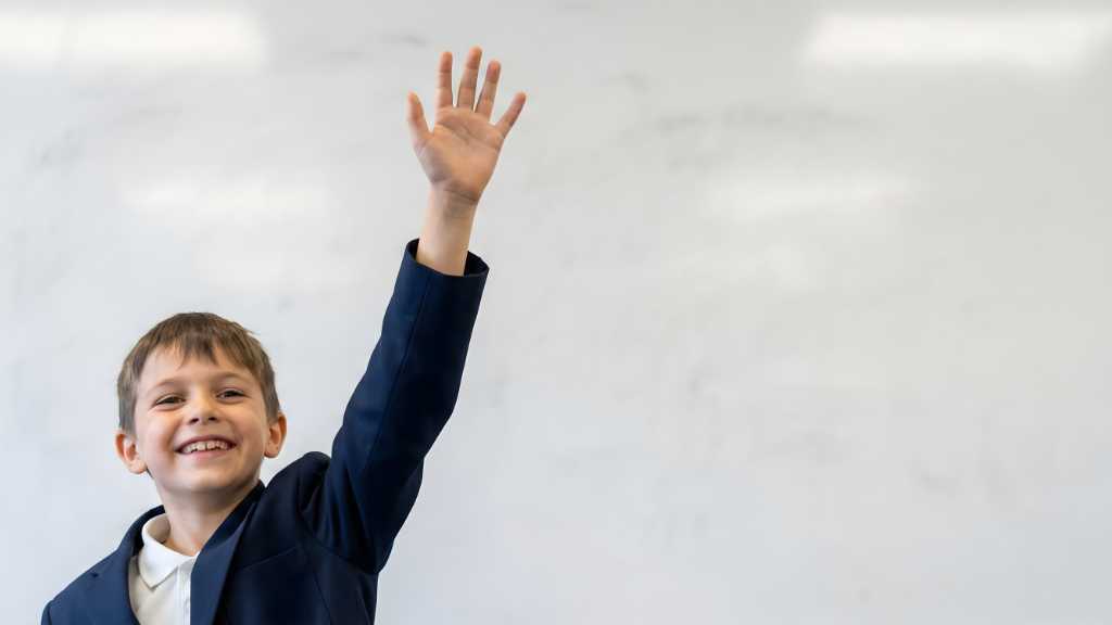 Student raising hand demonstrating decision making skills and autism empowerment